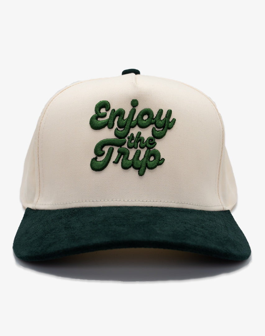Two-tone snapback with 'Enjoy the Trip' puff embroidered on it
