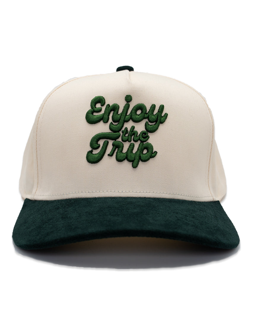 Two-tone snapback with 'Enjoy the Trip' puff embroidered on it