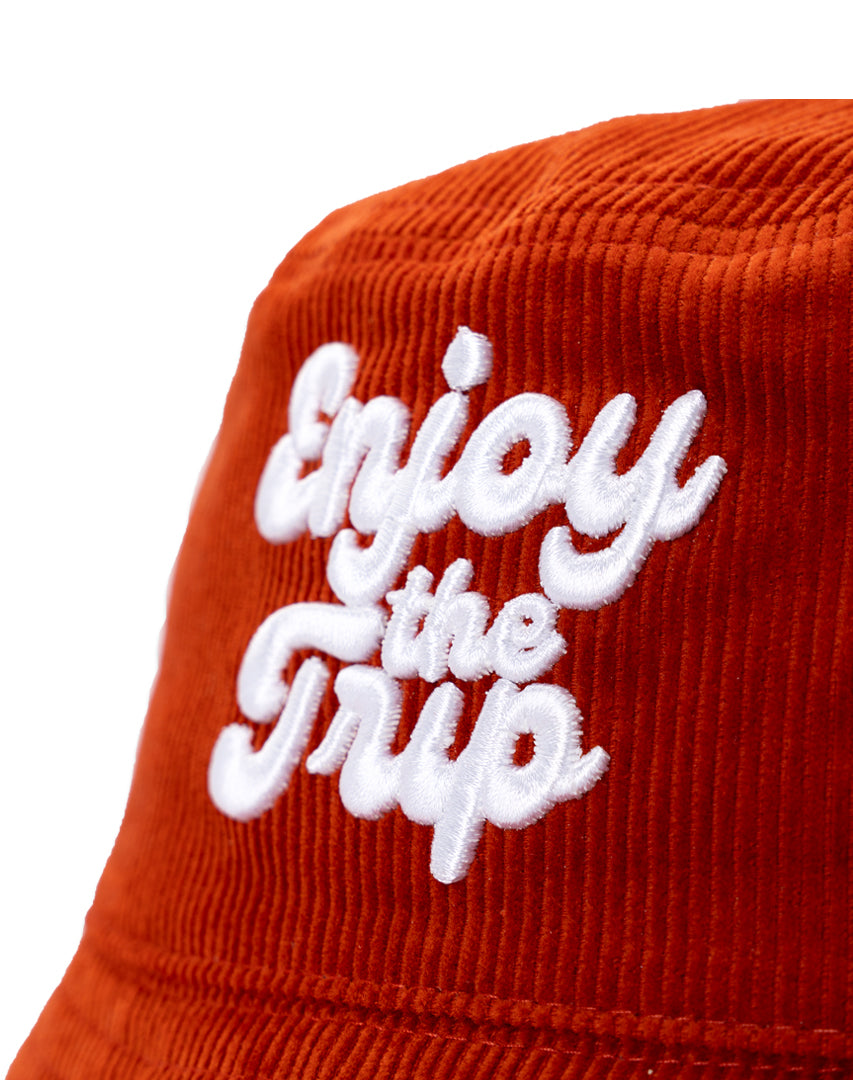 Rust bucket hat with 'Enjoy the Trip' 