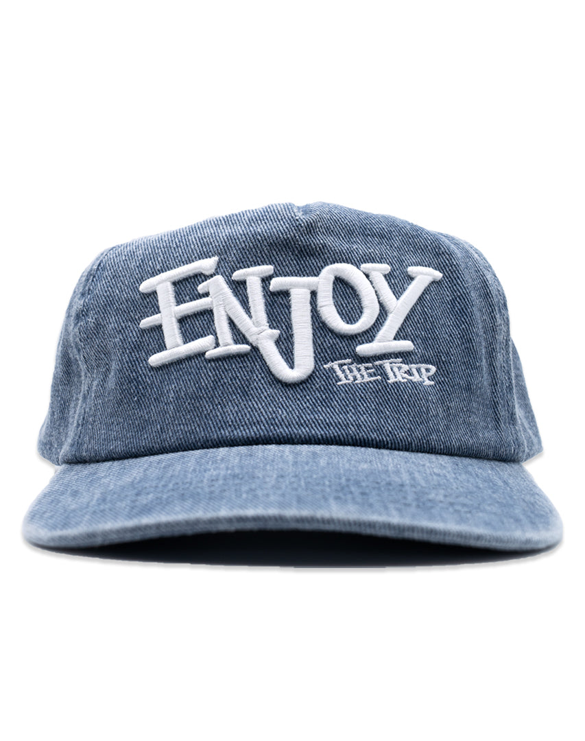 Blue Washed Denim hat with white embroidery 'ENJOY THE TRIP' on a white background
