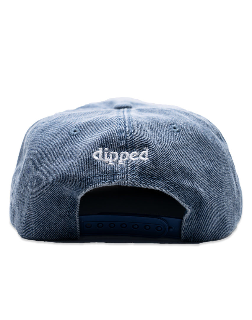 Blue Washed Denim hat with white embroidery 'ENJOY THE TRIP' on a white background
