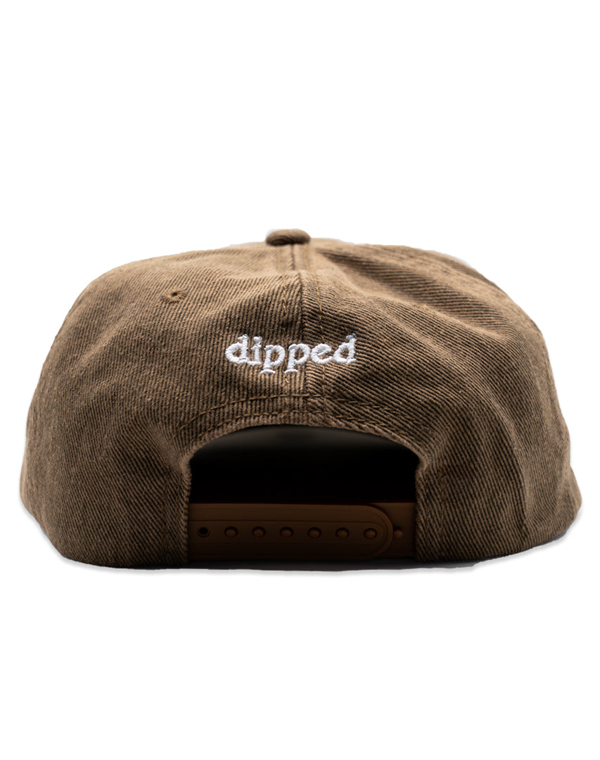 Khaki Washed Denim hat with white embroidery 'ENJOY THE TRIP' on a white background
